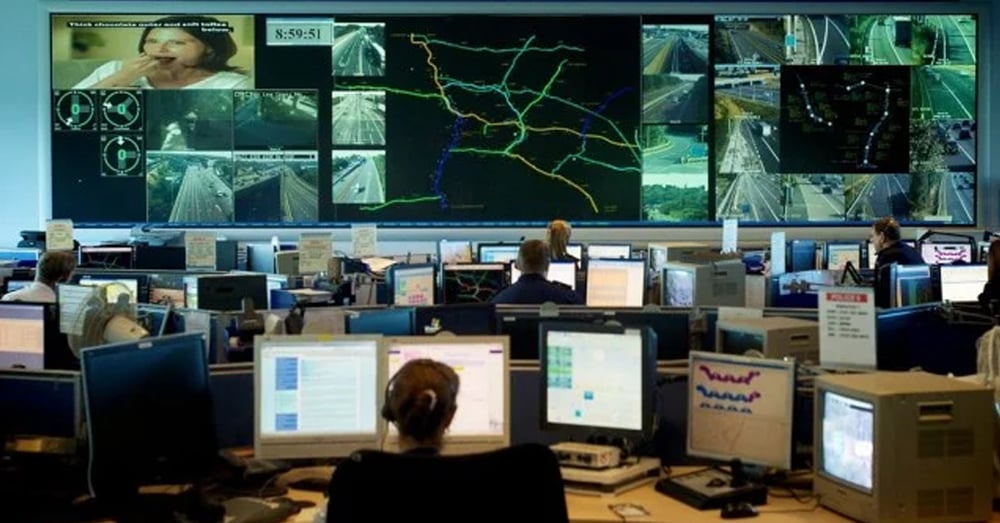 Emergency Operation Center, with video walls displaying live traffic cameras and routes, and employees working at workstations